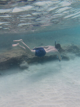 Man Snorkeling in the Clear Waters of Kenepa Chiki, Curacao