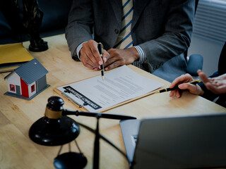 A close-up image of businessmen and lawyers, depicting concepts related to real estate law and...