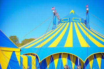 A circus tent or marquee setup in an outdoor park. Bright colors of the Fantasia Circus © david