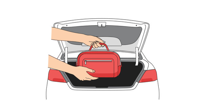 Two human hands carefully place a small red zippered travel bag into the dark carpeted trunk of a white sedan car during meticulous trip preparation.