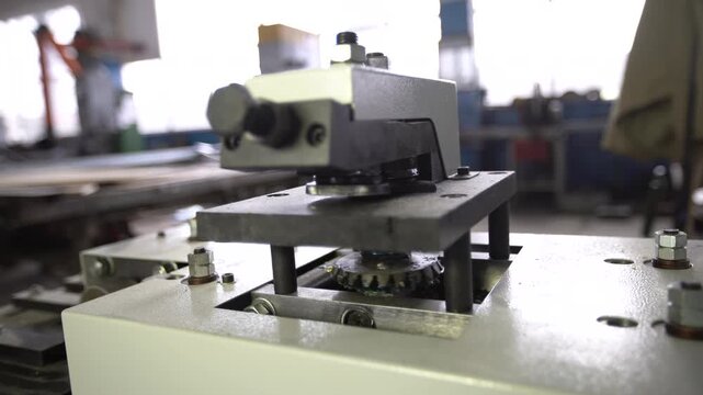 Industrial edge bending machine idling in the workshop