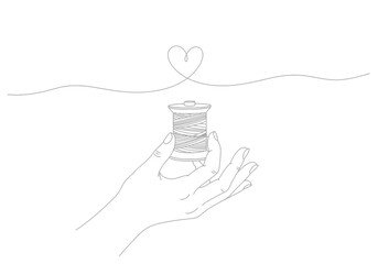Hand holding a spool of thread with a continuous line forming a heart shape © Vector Line