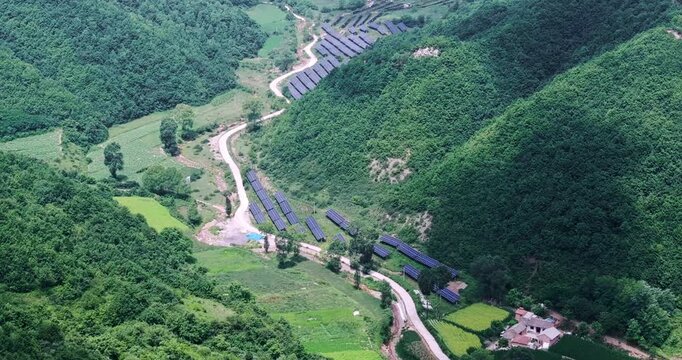 aerial view of a village and photovoltaic power station