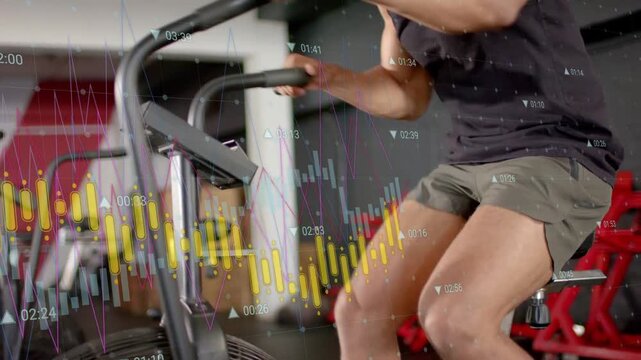 Man pedaling and leaning on fan bike in fitness gym, following yellow waveform bars guiding effort