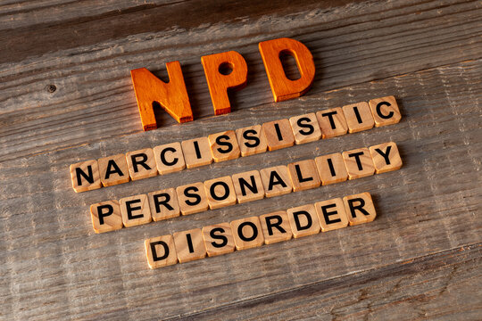 NPD abbreviation and its individual words: Internal Narcissistic Personality. Rustic wooden background.
