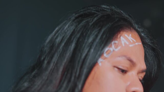 Artistic Profile with Text on Forehead