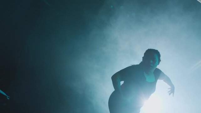 Dancer in Dramatic Stage Lighting