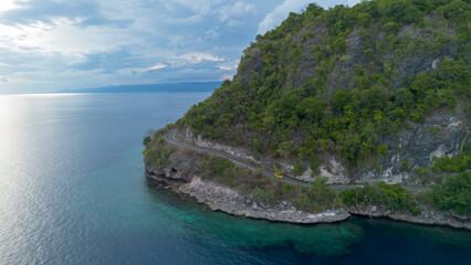Naklejka premium Aerial View of Coastal Road on a Cliffside