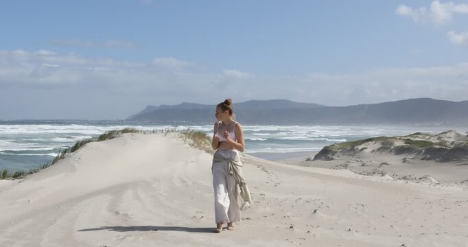 teens and children sand boarding dunes, Walker Bay Nature Reserve, Stanford, South Africa