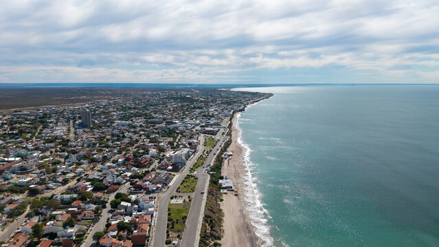 Aerial panoramic view of Las Grutas coastal city and the Atlantic Ocean.