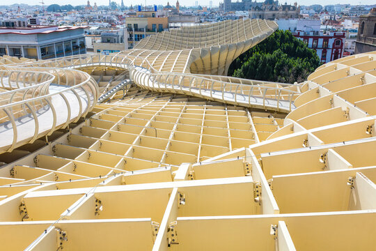 Seville, Andalusia, Spain &ndash; Feb 13, 2020: An elevated view showcasing the intricate wooden lattice structure and winding walkways of the Metropol Parasol, known as Las Setas, overlooking the expansive