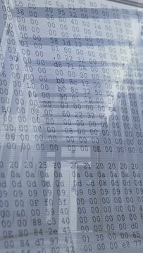 Vertical video: Metal corridor holding center while sensor starting hex overlay scrolling to scan