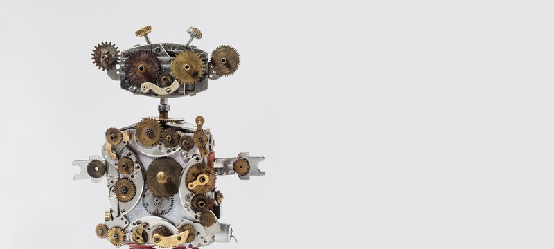 Close-up of steampunk robot made of gears, clockwork parts and old watch spares, copy space on white background. Engineering poster, machinery advertisement, industrial design banner