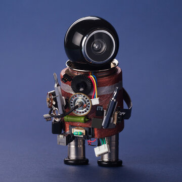 Toy robot handyman fixer holding two screwdrivers. Device repair flyer, home appliance leaflet, technical service advertisement
