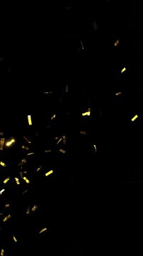 Super slow motion of flying confetti isolated on black background. Filmed on high speed cinema camera