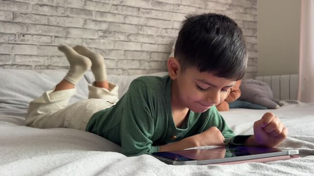 A small child is watching a video