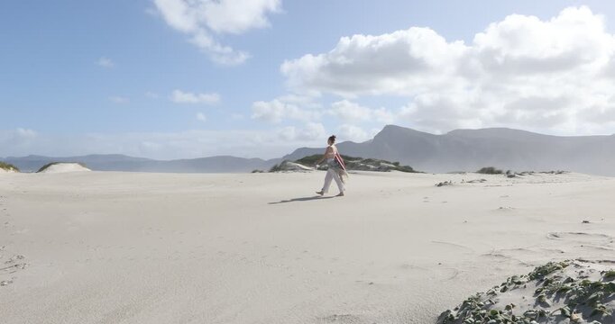 teens and children sand boarding dunes, Walker Bay Nature Reserve, Stanford, South Africa