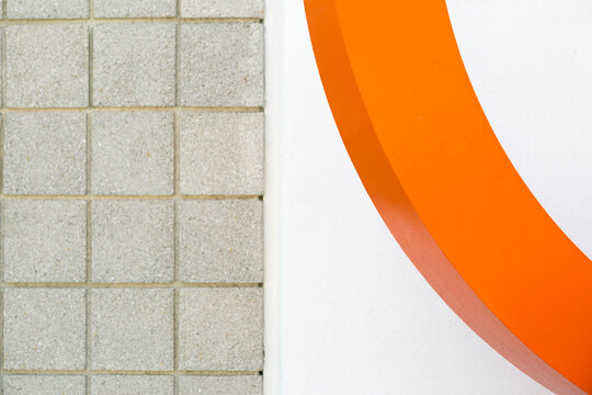 Mid century modern orange curve with tiled wall abstract