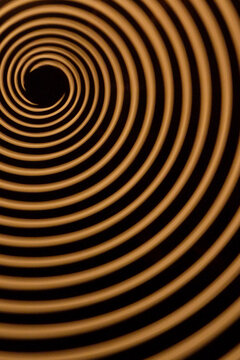 Black and bronze concentric ring abstract background