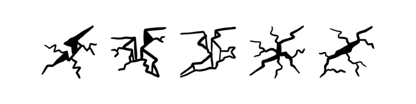 Set of hand-drawn black crack icons and fissure sketches on a white background. Perfect for representing ground damage, broken surfaces, or earthquake effects in a minimalist vector style.
