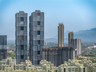 Obraz premium Modern City high-rise skyscraper buildings. Aerial drone view of the Financial District in Mumbai. Daytime Mumbai City, India