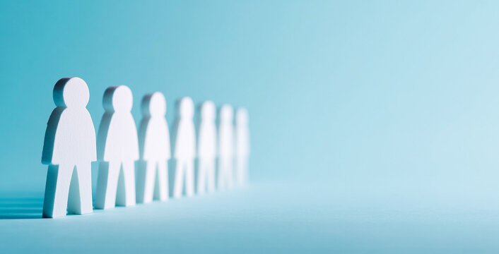 Abstract White Human Figures Standing in a Straight Line on a Light Blue Surface with Soft Side Lighting Creating Long Dramatic Shadows