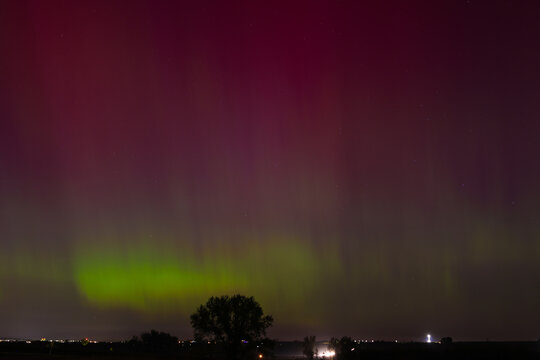 Aurora Northern Lights Over Rural Colorado Night Landscape With Colorful Green And Purple Sky