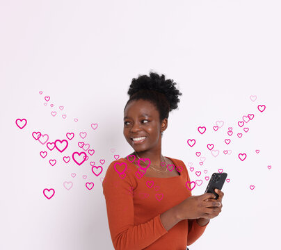Happy woman received romantic message against white background. Hearts flying out of mobile phone