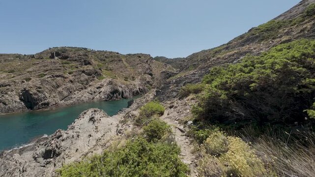 Hiking on a scenic coastal path along the rocky coastline