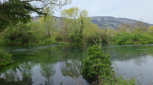 A stunning view of the Tirino River near Bussi sul Tirino, L'Aquila. Known as the cleanest river in Italy and Europe, it features incredibly transparent emerald green water