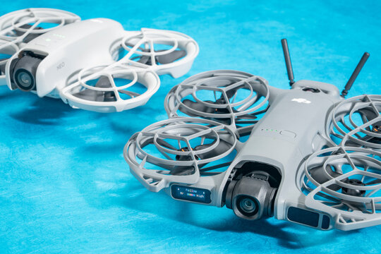 Fort Collins, CO, USA - April 8, 2026: DJI Neo 2 mini drone and its original model on art paper. It offers a creative and fun alternative to a selfie stick or tripod.