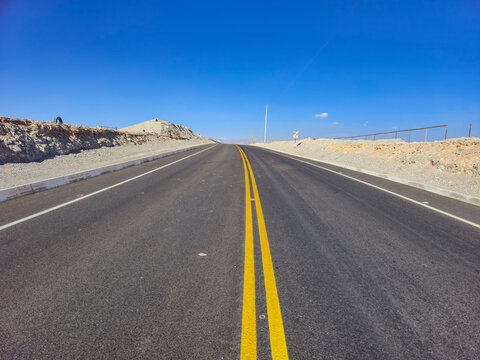 Asphalt road with reflective and phosphorescent yellow paint marking files