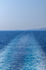 Fototapeta premium View of wave trails of a floating ferry boat at the Aegean Sea in Greece