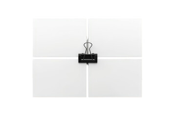 Fototapeta premium Four blank white square paper notes held by a black binder clip, creating a grid for business, office, or creativity with transparent background