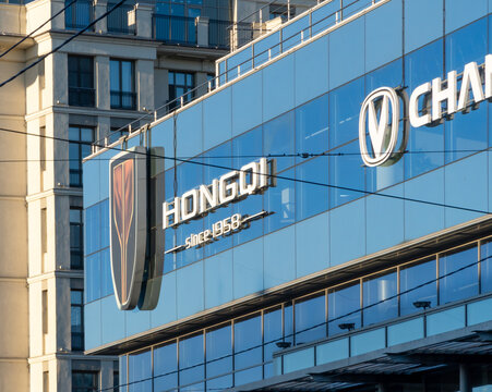 Dealer store Hongqi. Brand's showroom Chinese dealership. Hongqi brand display model cars in showroom or retail space, showcasing luxury automotive heritage of Chinese manufacturer founded in 1958. 