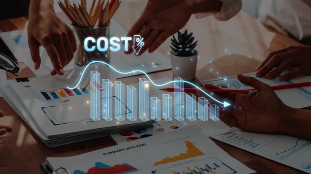 A diverse group of professionals engages in a dynamic discussion over financial data, with digital graphs illustrating cost trends and enhancing strategic decisions. Raster