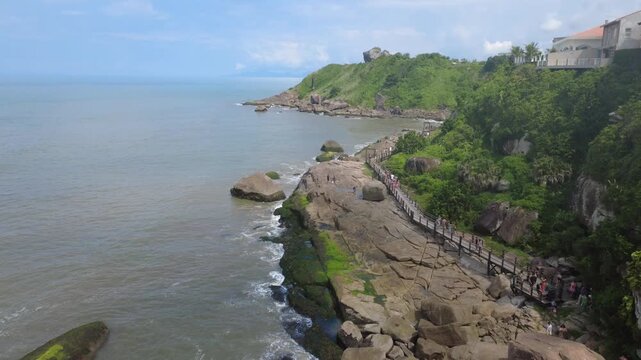 Rocky Coastal Trail Surrounded by Tropical Nature
