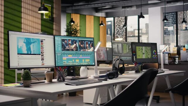 Film editing workflow, empty office with dual monitors, software with cinematic project. Recorded clips footage in the program with motion graphics panels and cutting tools, creative process.