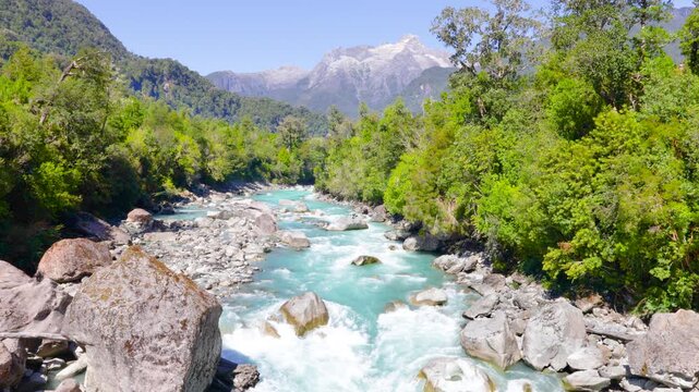 Hornopir&eacute;n, Chile - March 20, 2026: The Blanco River, with its turquoise waters, flows through the lush nature of Chilean Patagonia. The majestic Cerro Cholila can be seen in the mountains.