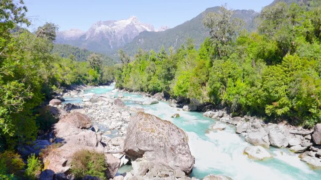 Hornopir&eacute;n, Chile - March 20, 2026: The Blanco River, with its turquoise waters, flows through the lush nature of Chilean Patagonia. The majestic Cerro Cholila can be seen in the mountains.