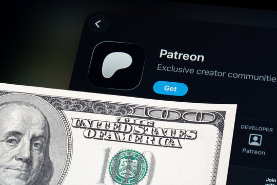 Patreon app on iPad showing Apple Liquid Glass redesign and iOS 26 App Store look beside US dollar banknote. Stafford, United Kingdom, April 13, 2026.