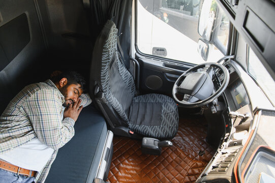 Truck driver sleeping resting inside cabin