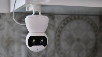Fototapeta na wymiar Indoor smart security camera for monitoring pets at home