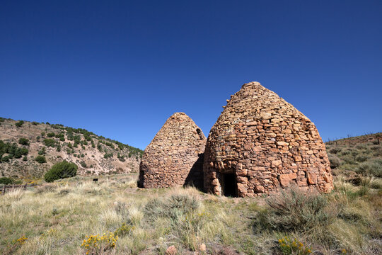 Historic stone Panaca Charcoal Kilns under blue sky in Nevada