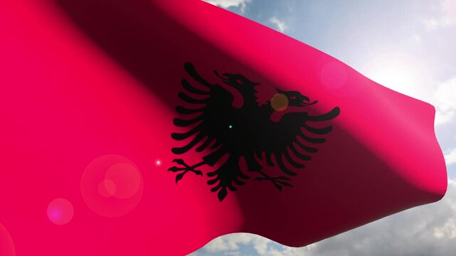 Albania Flag Fluttering Gracefully Against the Open Sky