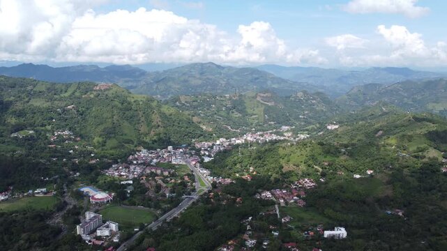 Aerial view from drone la vega town in cundinamarca Colombia, Mountains arround blue sky.