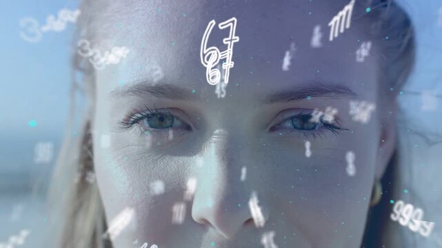 Woman opening eyes as drifting numeric particles prompt smile, showing tech data overlay over coast