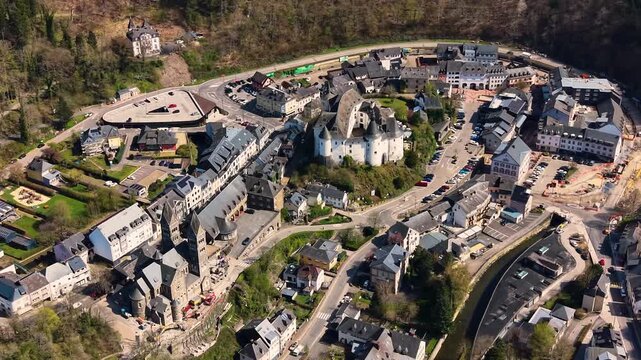 A panoramic Aerial view of the city and castle  Clervaux in Luxembourg, on a sunny spring noon
