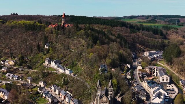 A panoramic Aerial view of the city and castle  Clervaux in Luxembourg, on a sunny spring noon