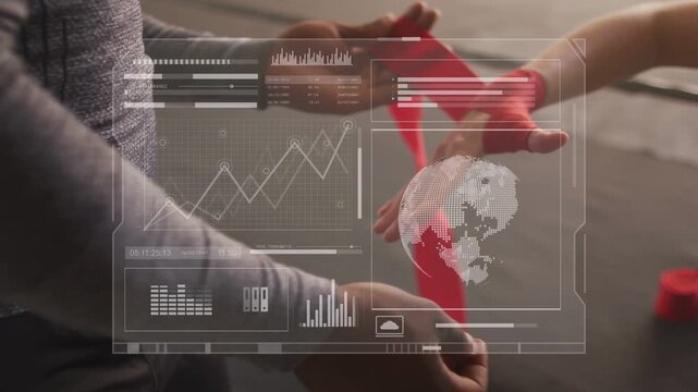 Trainer placing red wrap on knuckles, wrapping athlete hand for gym training with HUD over charts